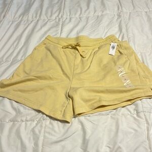 Pale yellow terry cloth ladies shorts size Large.